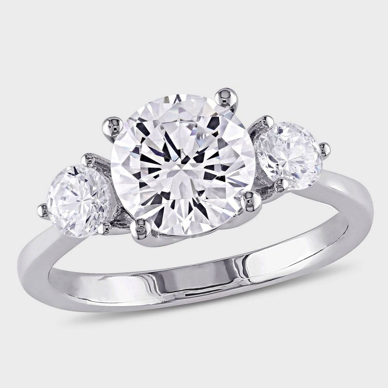 Glittering Round Three-Stone Moissanite Engagement Ring White Gold