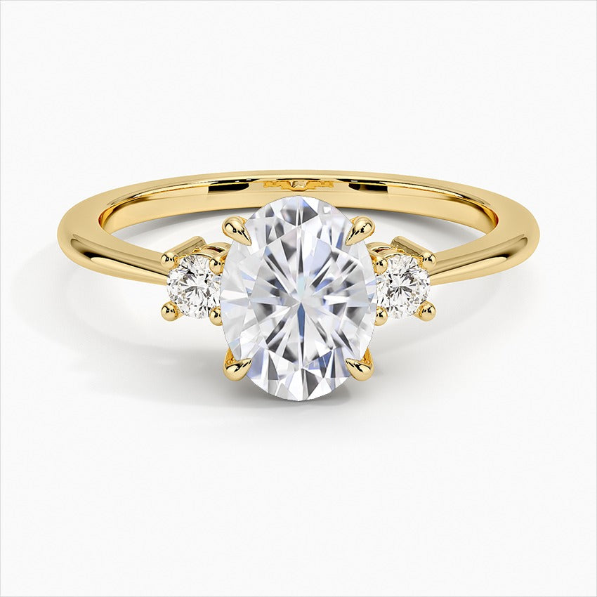 Solace Four-Prong Oval Three Stone Moissanite Engagement Ring Yellow Gold