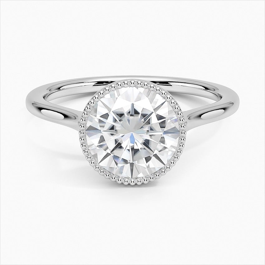 Spellbound Round Cut Bezel Statement Moissanite Engagement Ring White Gold