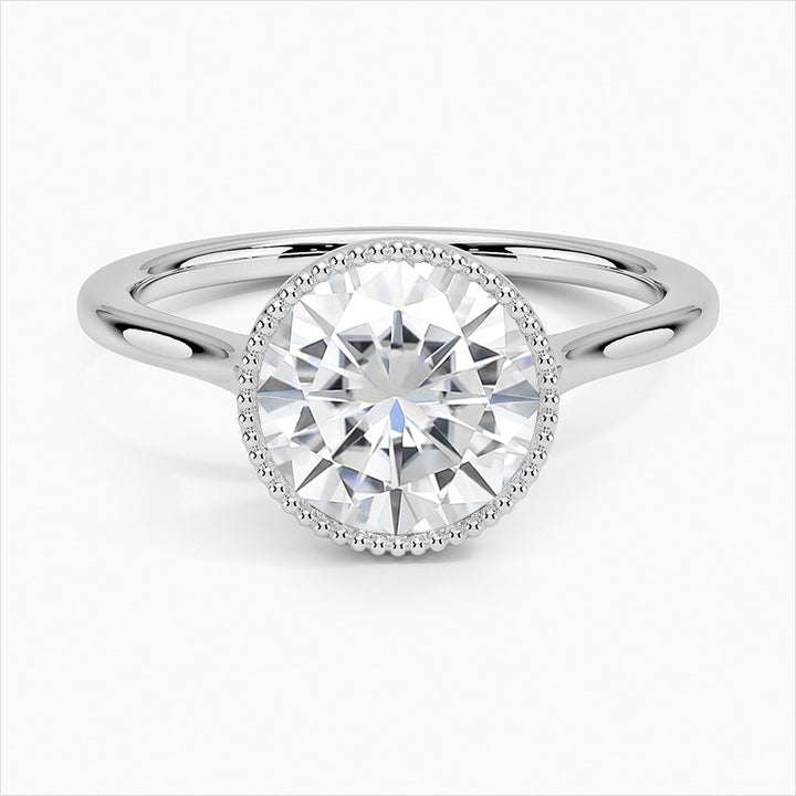 Spellbound Round Cut Bezel Statement Moissanite Engagement Ring White Gold