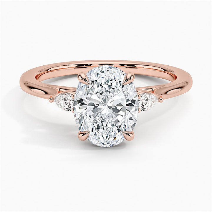 Token 4-Prong Three Stone 3 Carat Oval Cut Moissanite Ring in 18K Rose Gold