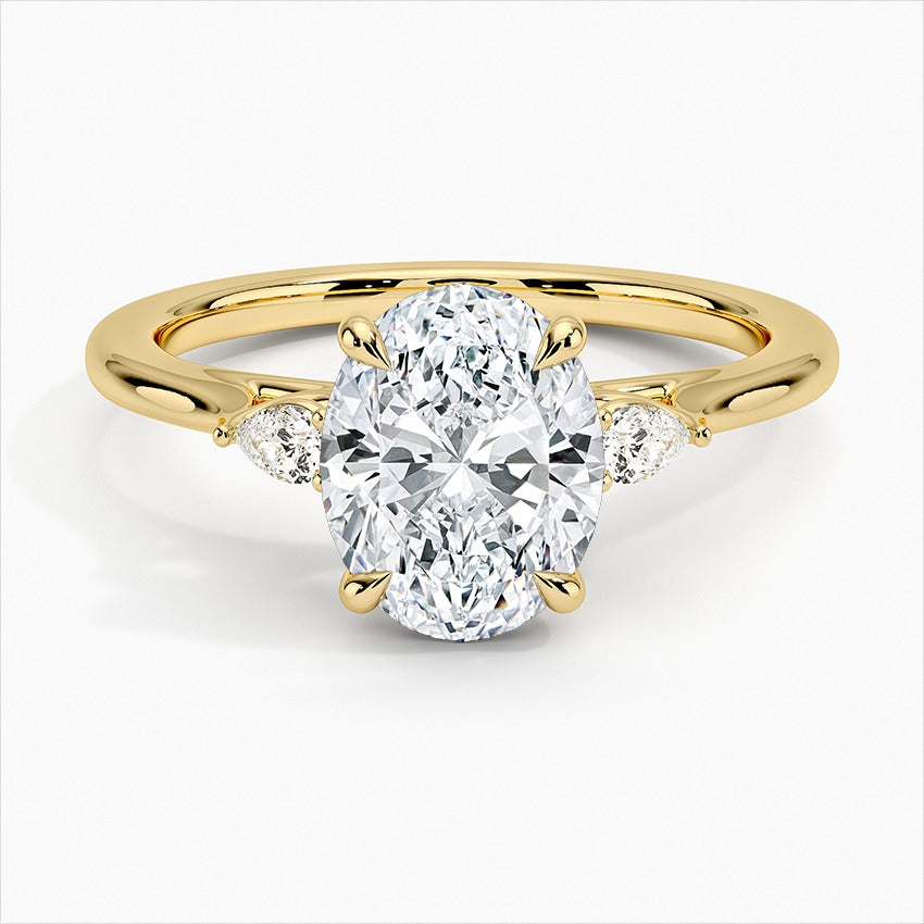 Token Oval 4-Prong Three Stone Moissanite Engagement Ring Yellow Gold